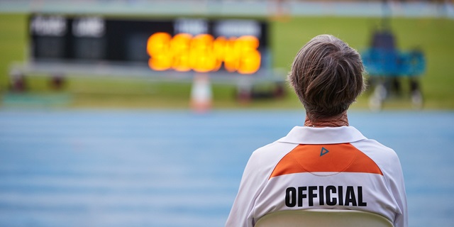 A photo of the back of an official